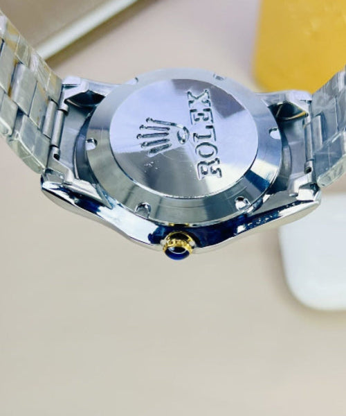 Close-up of a Rolex watch back cover with a blurred background