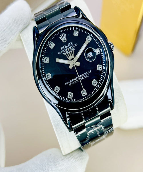 Luxury watch with a black dial and silver case on a white background