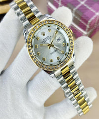 Luxury watch with silver and gold band on a white background