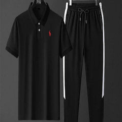Black polo shirt and pants set with a red logo on a gray background