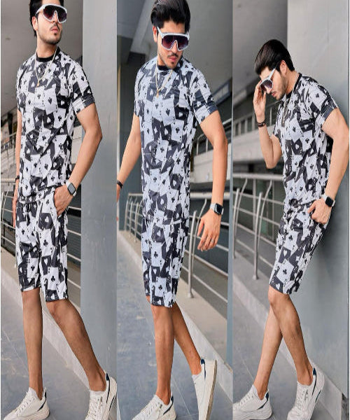 Man wearing a black and white patterned outfit with sunglasses in an urban setting