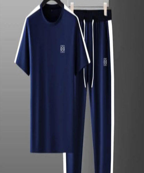 Navy tracksuit with white accents on a gray background