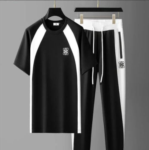 Black and white outfit with logo on a gray background