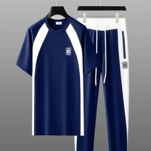 Navy tracksuit with white accents on a gray background