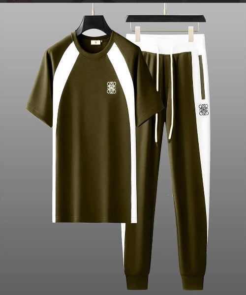 Green tracksuit with white accents on a gray background