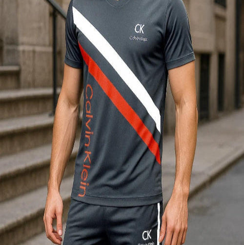 Person wearing Calvin Klein athletic outfit on a city street.