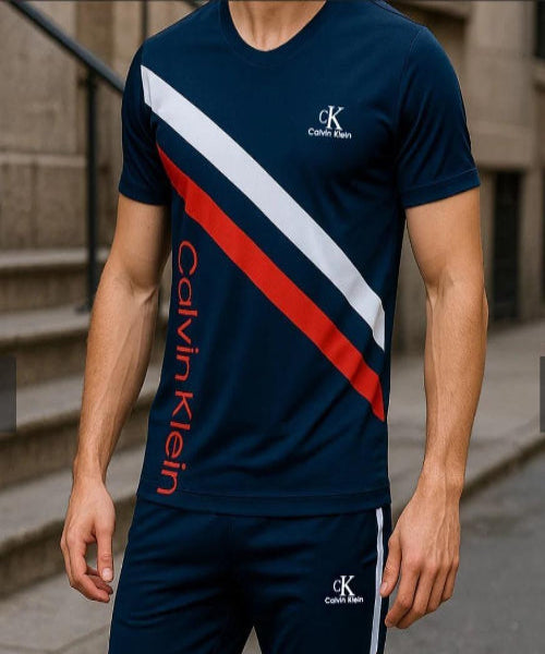 Person wearing a Calvin Klein tracksuit with a blue, red, and white design.