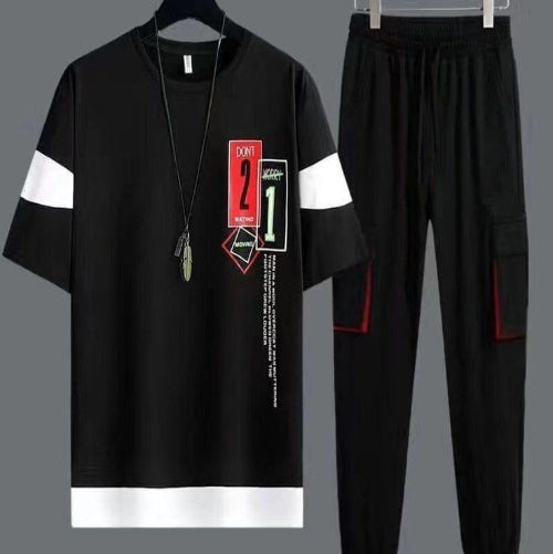 Black outfit with white accents and graphic design on a gray background