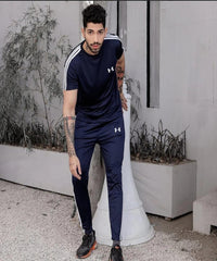 Man wearing Under Armour outfit posing outdoors