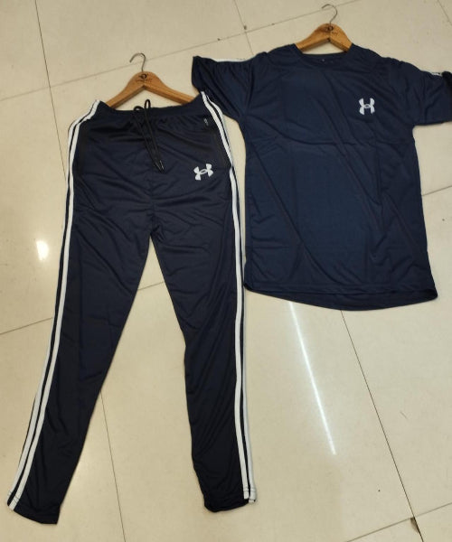 Navy tracksuit with white stripes on a tiled floor